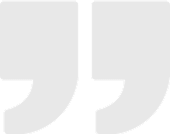 Gray quotation marks on black background.