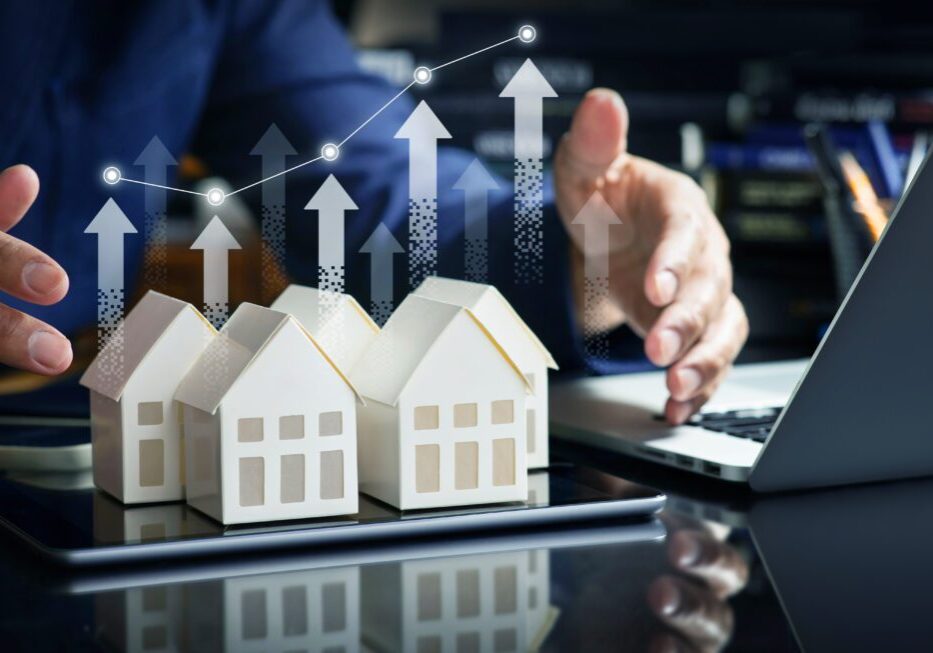 Rising real estate market concept with arrows.